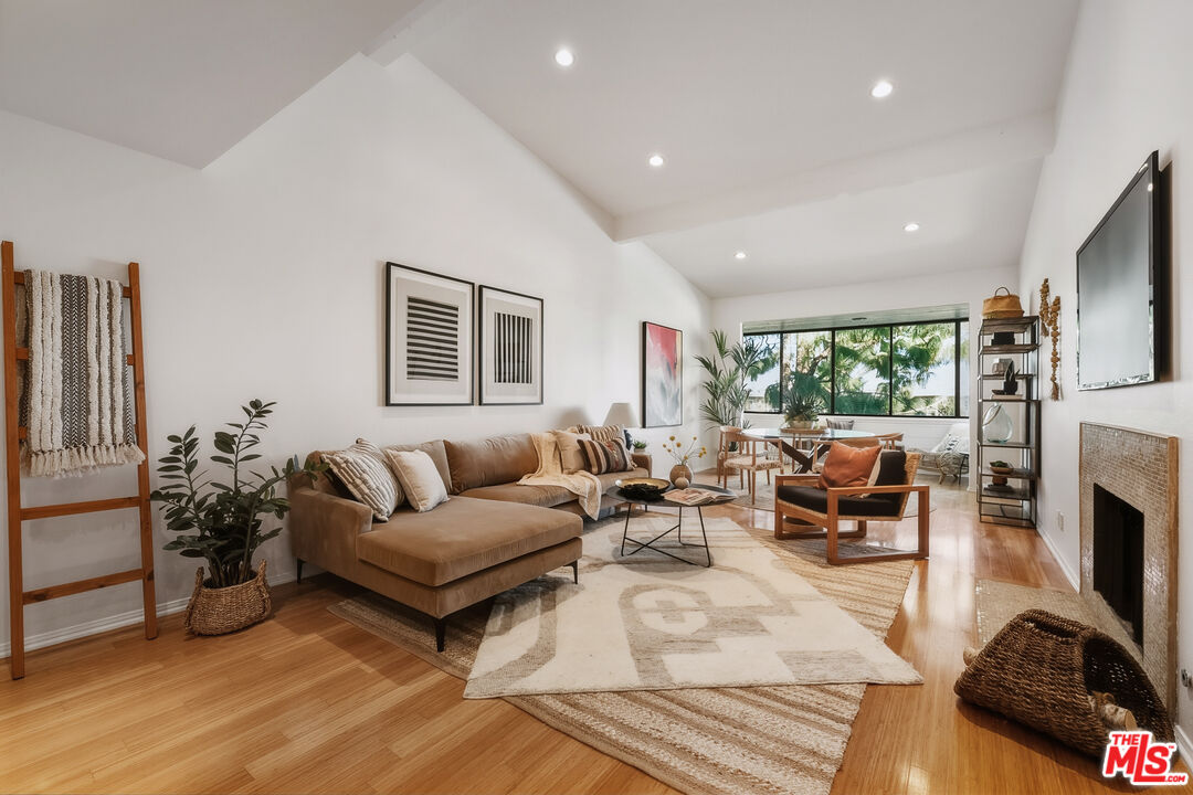 a living room with furniture fireplace and a flat screen tv