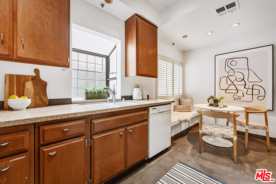 311 Bora Bora Way, Unit 315 Marina del Rey, CA 90292 - Photo 12 of 34 a spacious bathroom with a granite countertop sink a mirror and a window