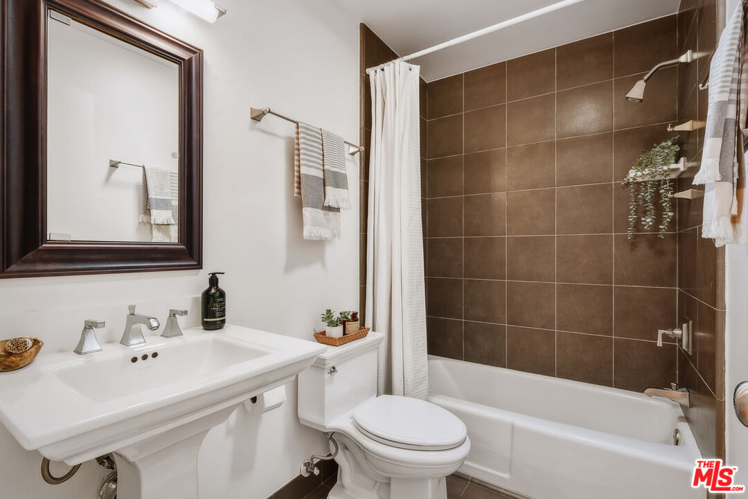 311 Bora Bora Way, Unit 315 Marina del Rey, CA 90292 - Photo 19 of 34 a bathroom with a sink toilet and shower