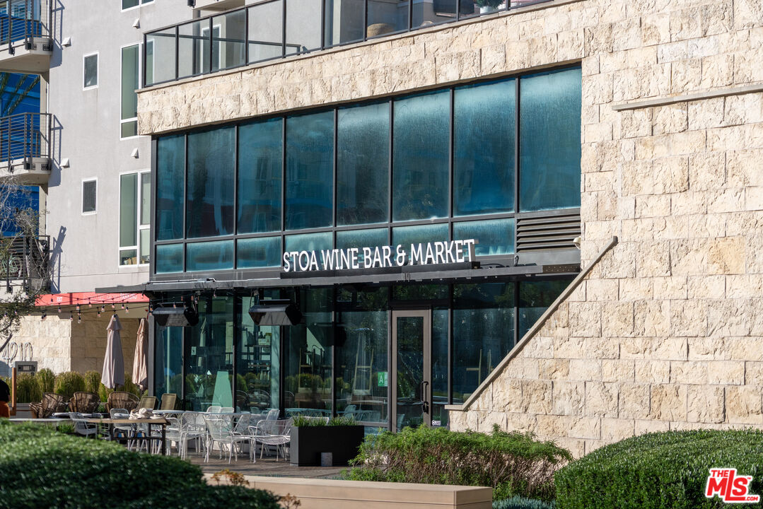 311 Bora Bora Way, Unit 315 Marina del Rey, CA 90292 - Photo 32 of 34 a front view of a building with a garden and plants