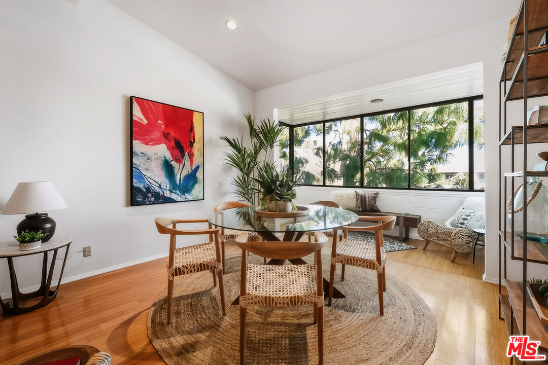311 Bora Bora Way, Unit 315 Marina del Rey, CA 90292 - Photo 7 of 34 a living room with furniture a flat screen tv and a large window