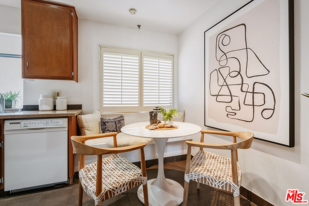 311 Bora Bora Way, Unit 315 Marina del Rey, CA 90292 - Photo 10 of 34 a kitchen with a table and chairs in it