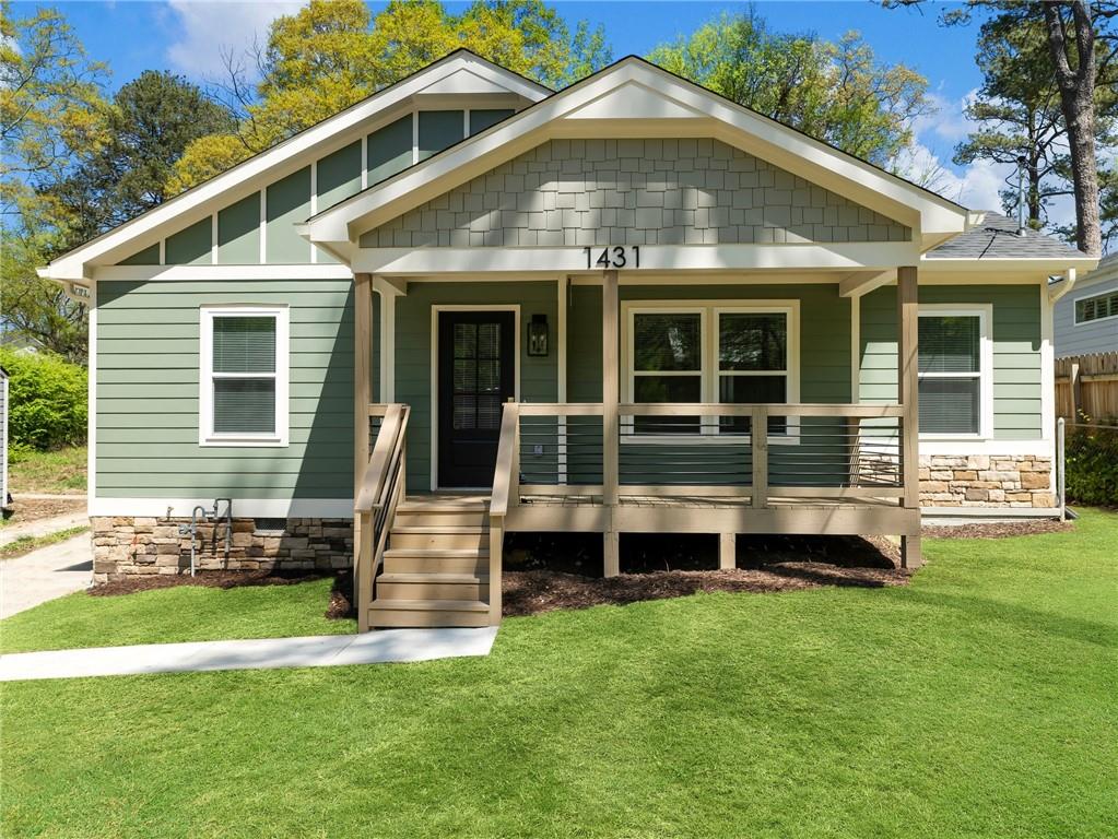 1431 Richland Road Southwest Atlanta, GA 30310 - Photo 1 of 1 a front view of a house with a garden