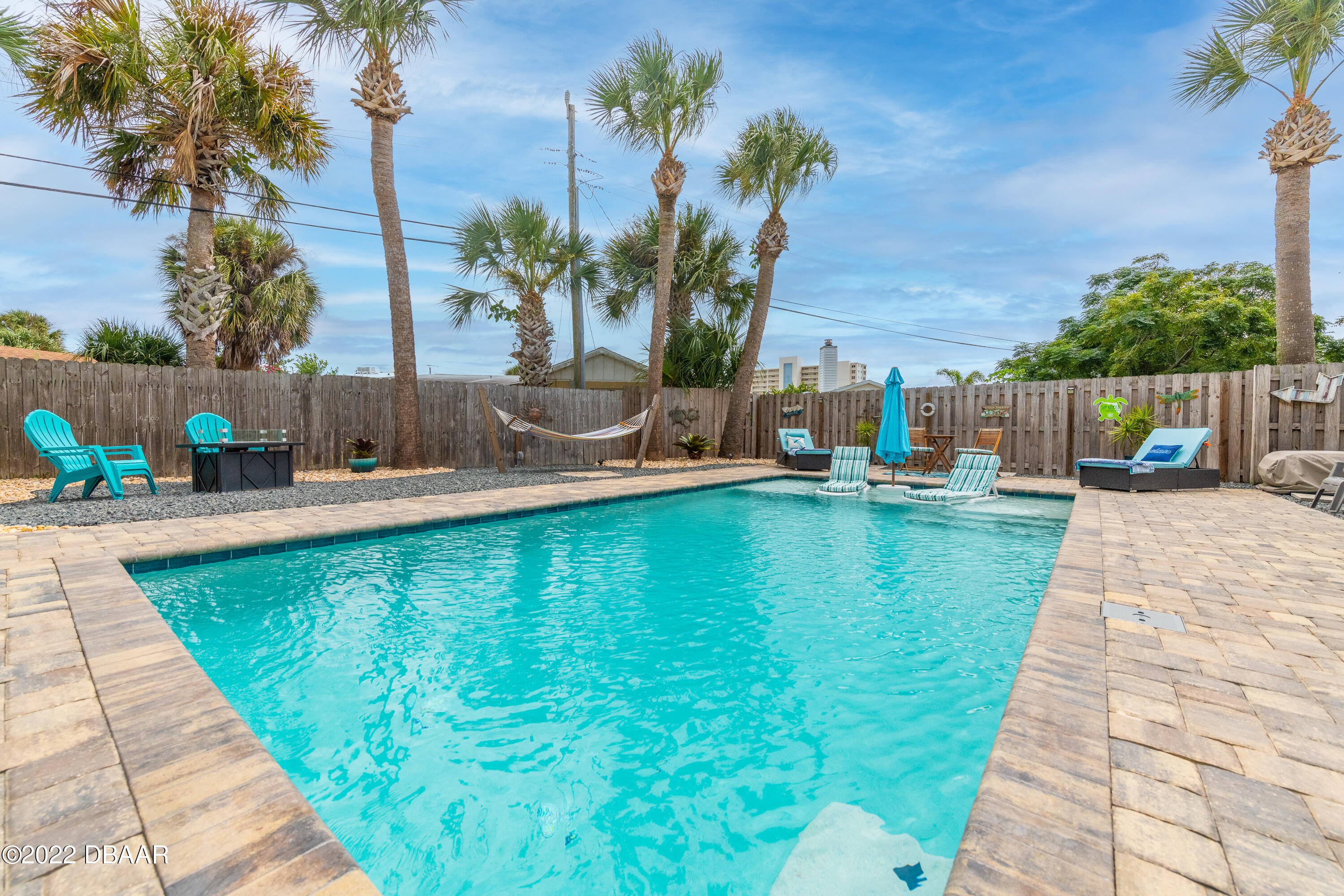 1253 Riverbreeze Boulevard Ormond Beach, FL 32176 - Photo 12 of 39 a view of a swimming pool with a patio