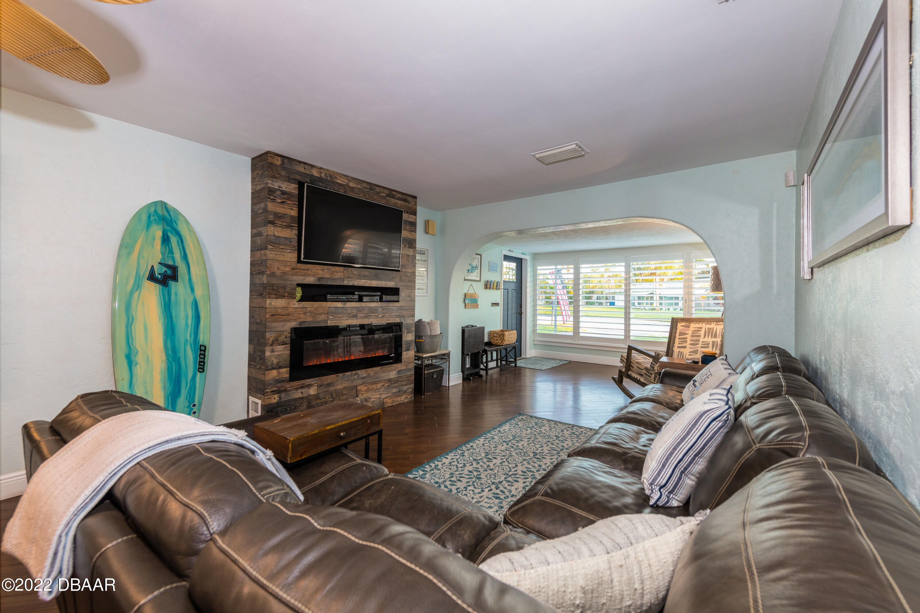 1253 Riverbreeze Boulevard Ormond Beach, FL 32176 - Photo 17 of 39 a living room with furniture and a flat screen tv