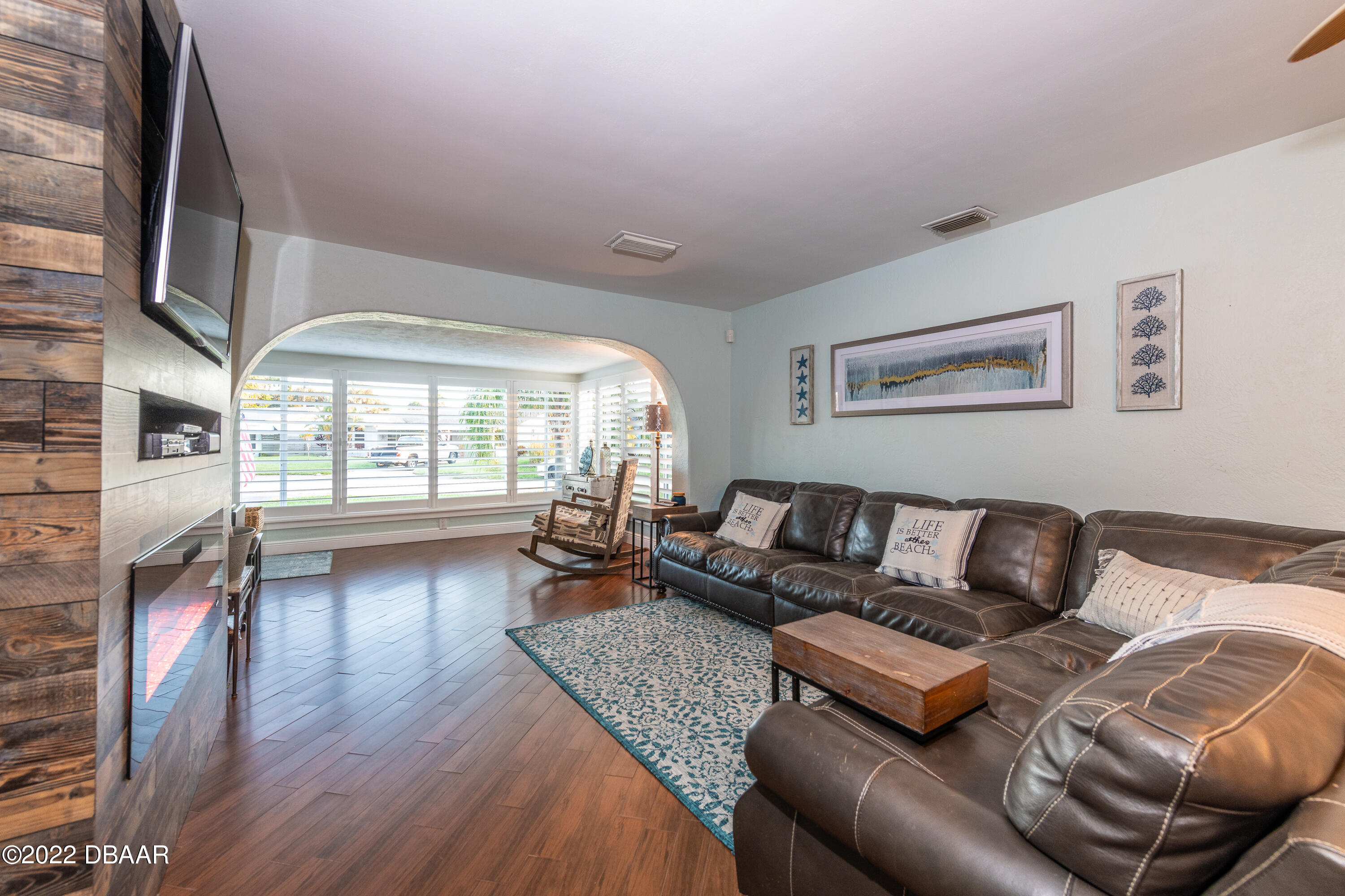 1253 Riverbreeze Boulevard Ormond Beach, FL 32176 - Photo 18 of 39 a living room with furniture and a large window