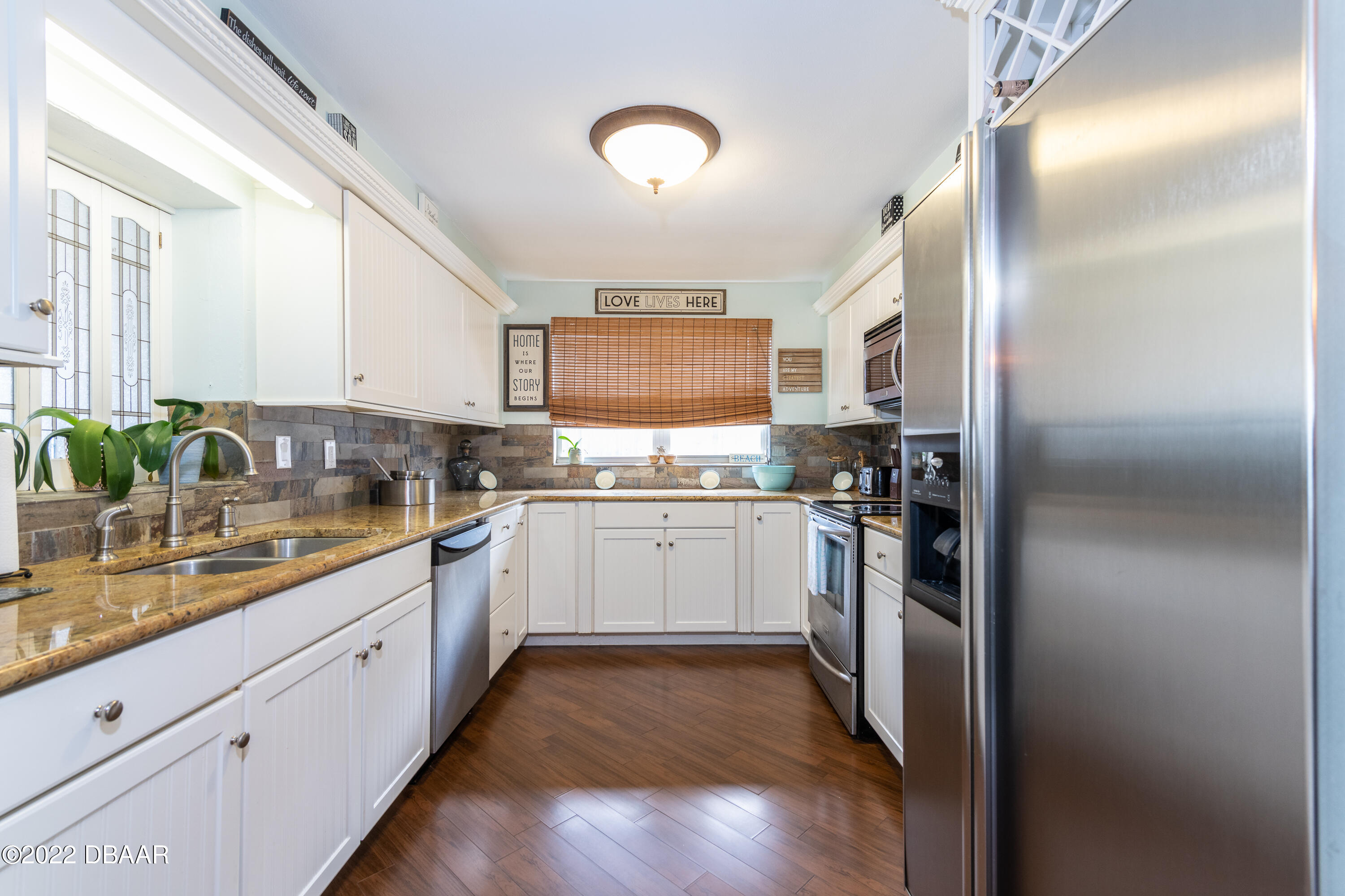 1253 Riverbreeze Boulevard Ormond Beach, FL 32176 - Photo 20 of 39 a kitchen with a refrigerator and a sink