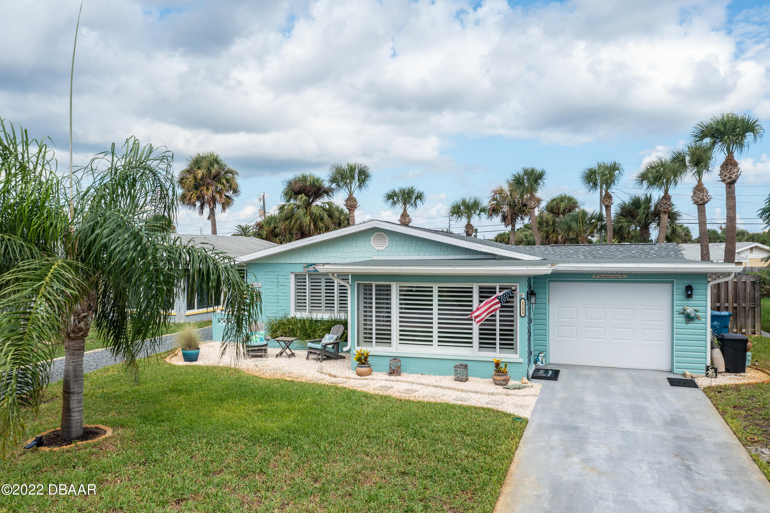 1253 Riverbreeze Boulevard Ormond Beach, FL 32176 - Photo 2 of 39 a front view of a house with garden