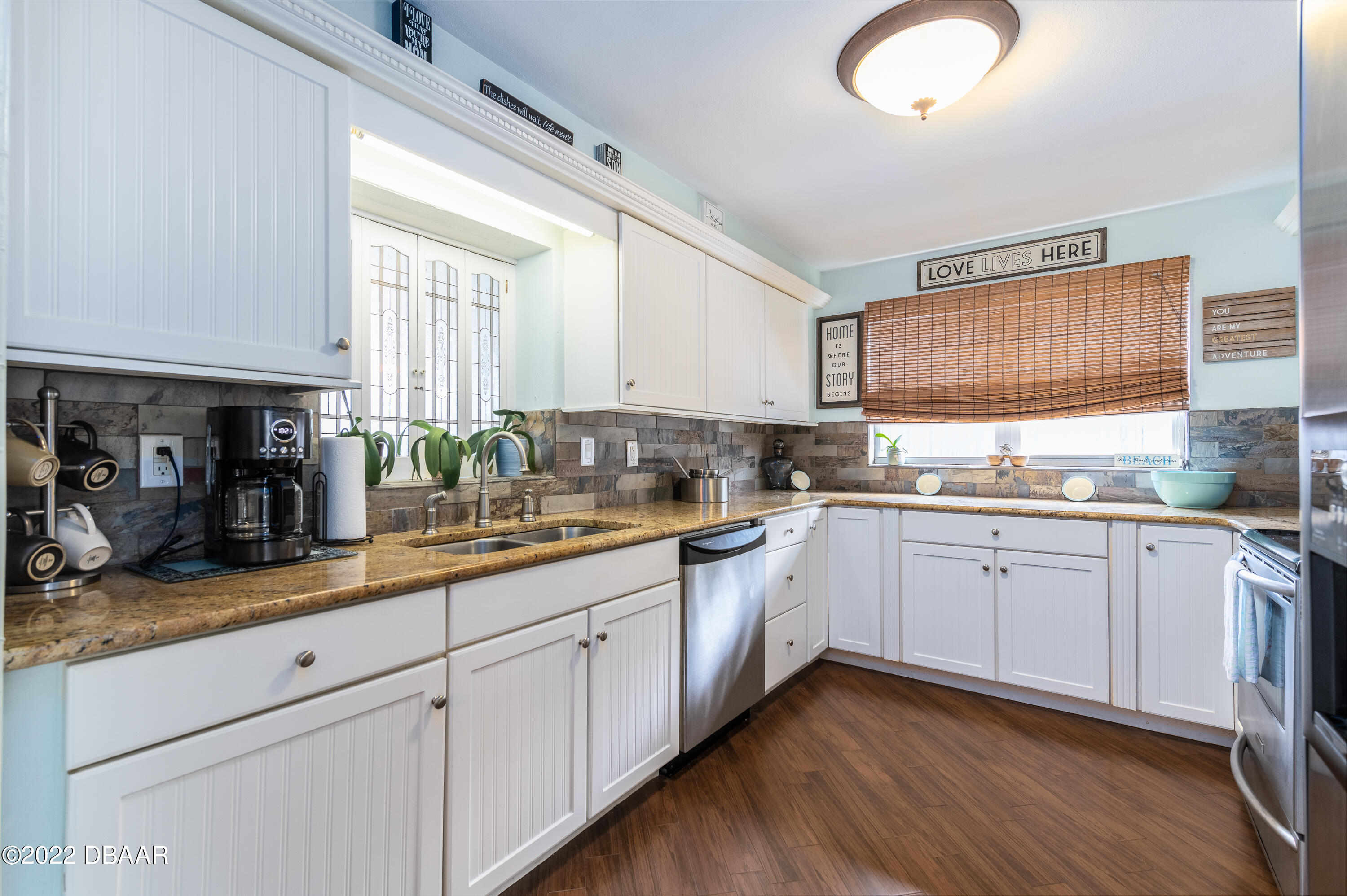 1253 Riverbreeze Boulevard Ormond Beach, FL 32176 - Photo 21 of 39 a kitchen with sink cabinets and window