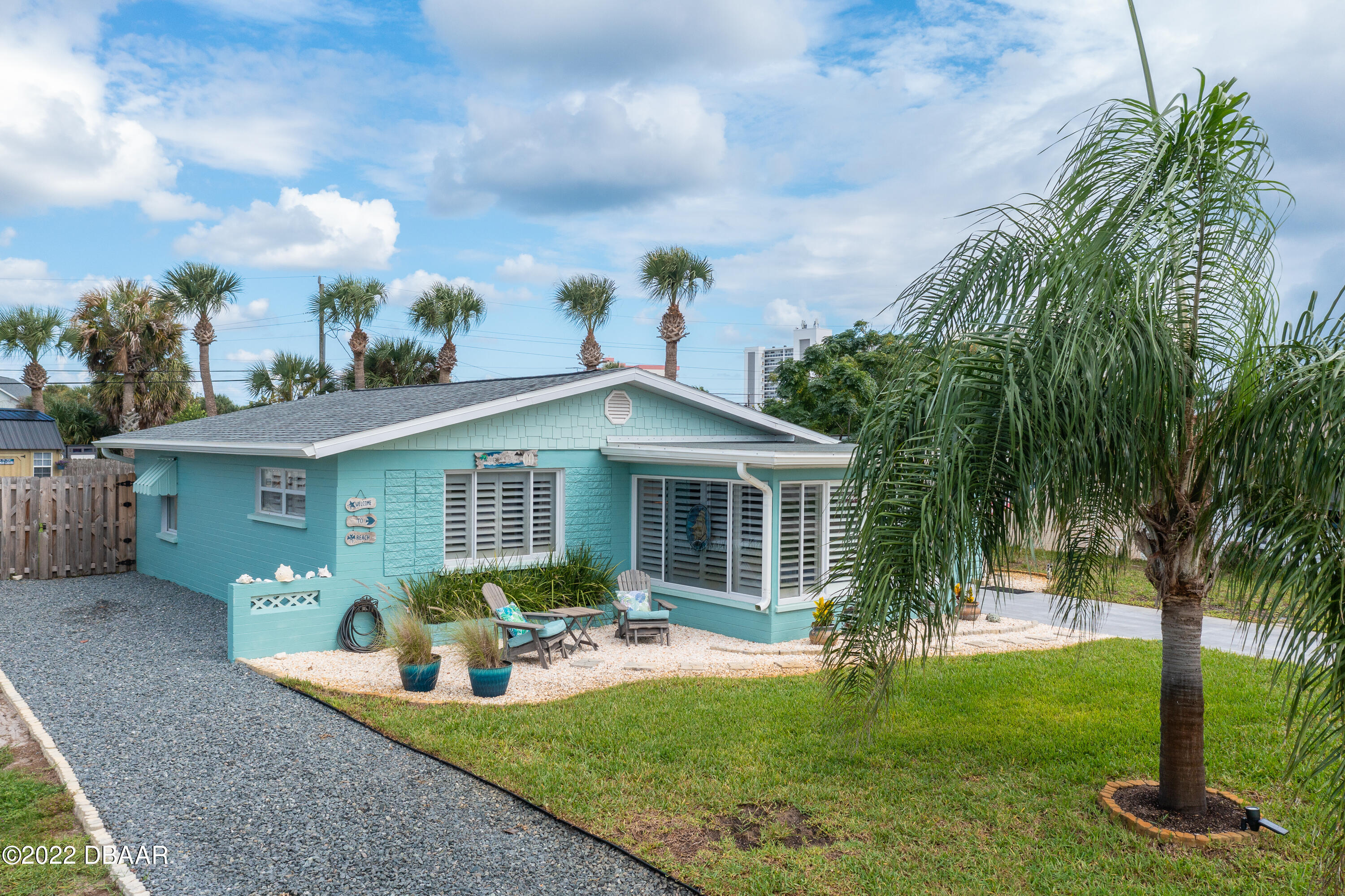 1253 Riverbreeze Boulevard Ormond Beach, FL 32176 - Photo 26 of 39 a view of a house with backyard sitting area and garden