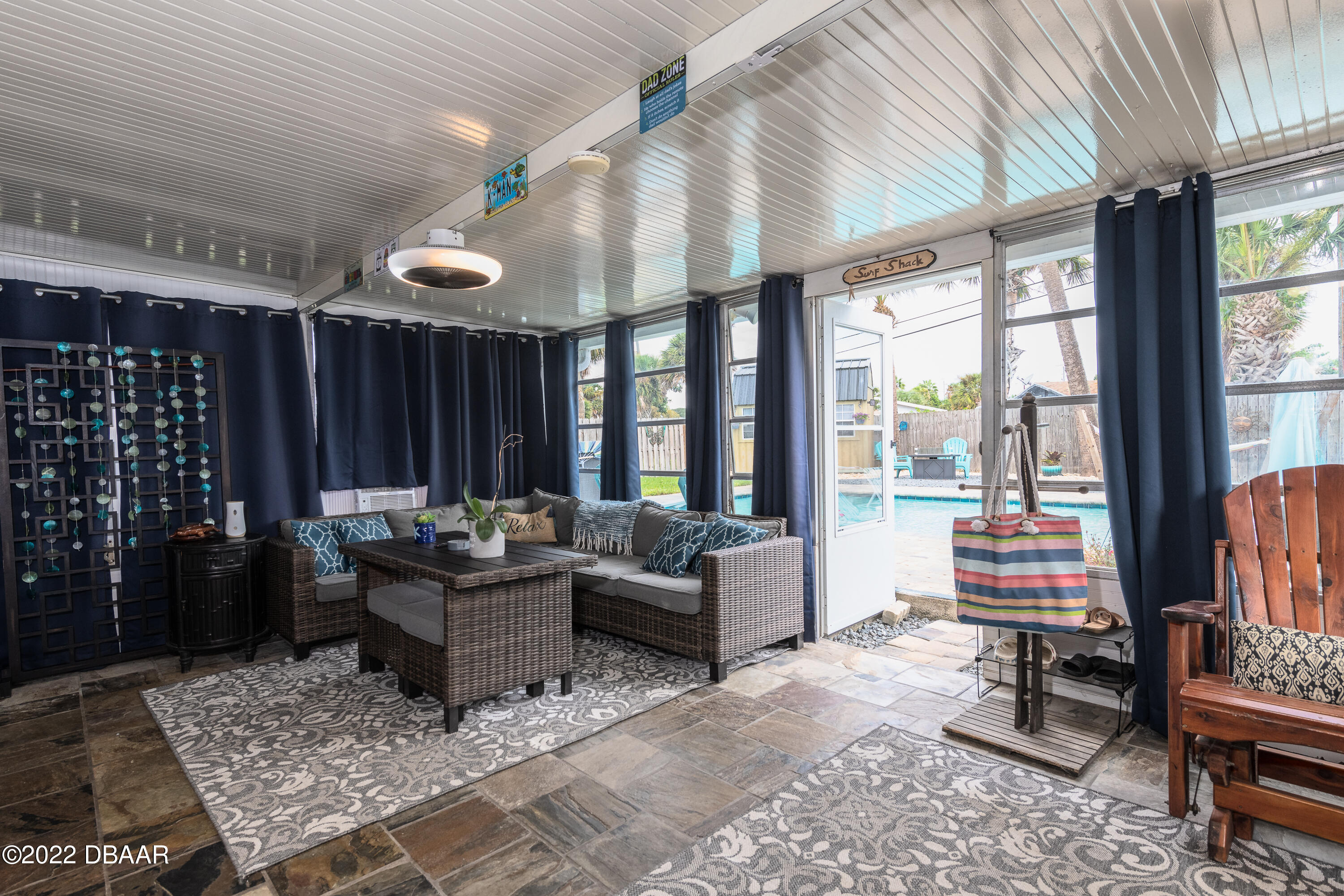 1253 Riverbreeze Boulevard Ormond Beach, FL 32176 - Photo 29 of 39 a living room with furniture and a large window