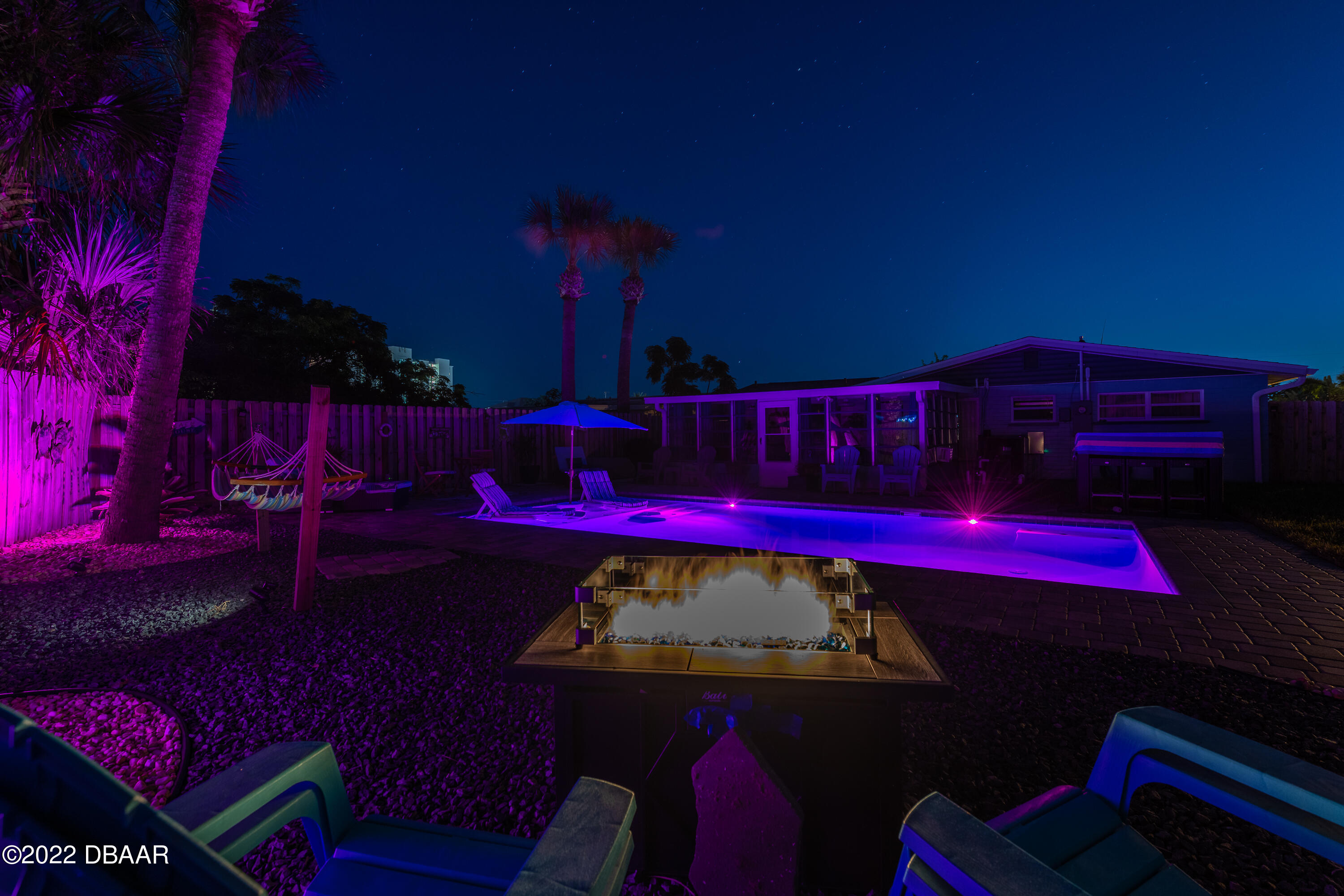1253 Riverbreeze Boulevard Ormond Beach, FL 32176 - Photo 36 of 39 a view of a deck with table and chairs with wooden fence