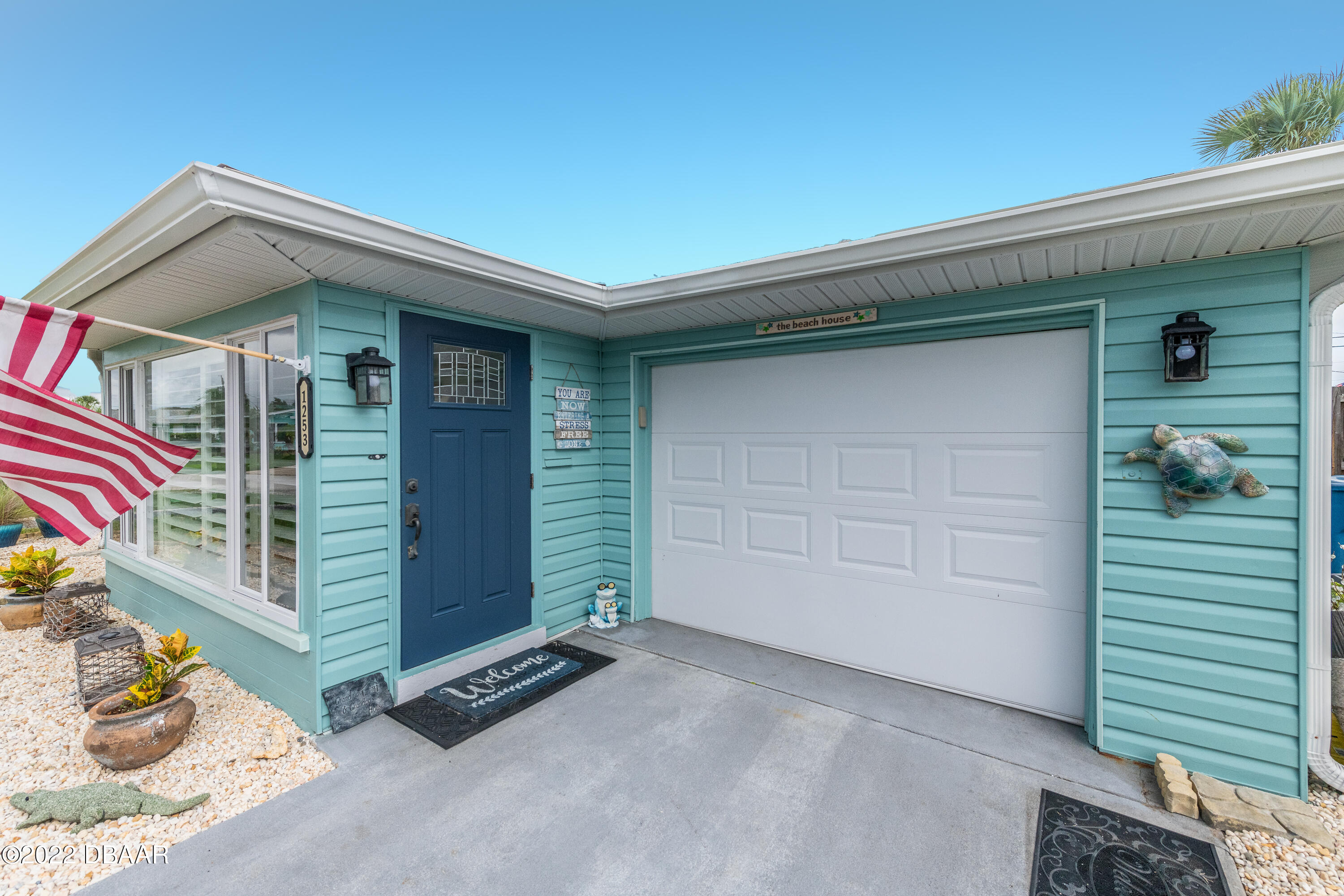 1253 Riverbreeze Boulevard Ormond Beach, FL 32176 - Photo 4 of 39 a front view of a house with a garage