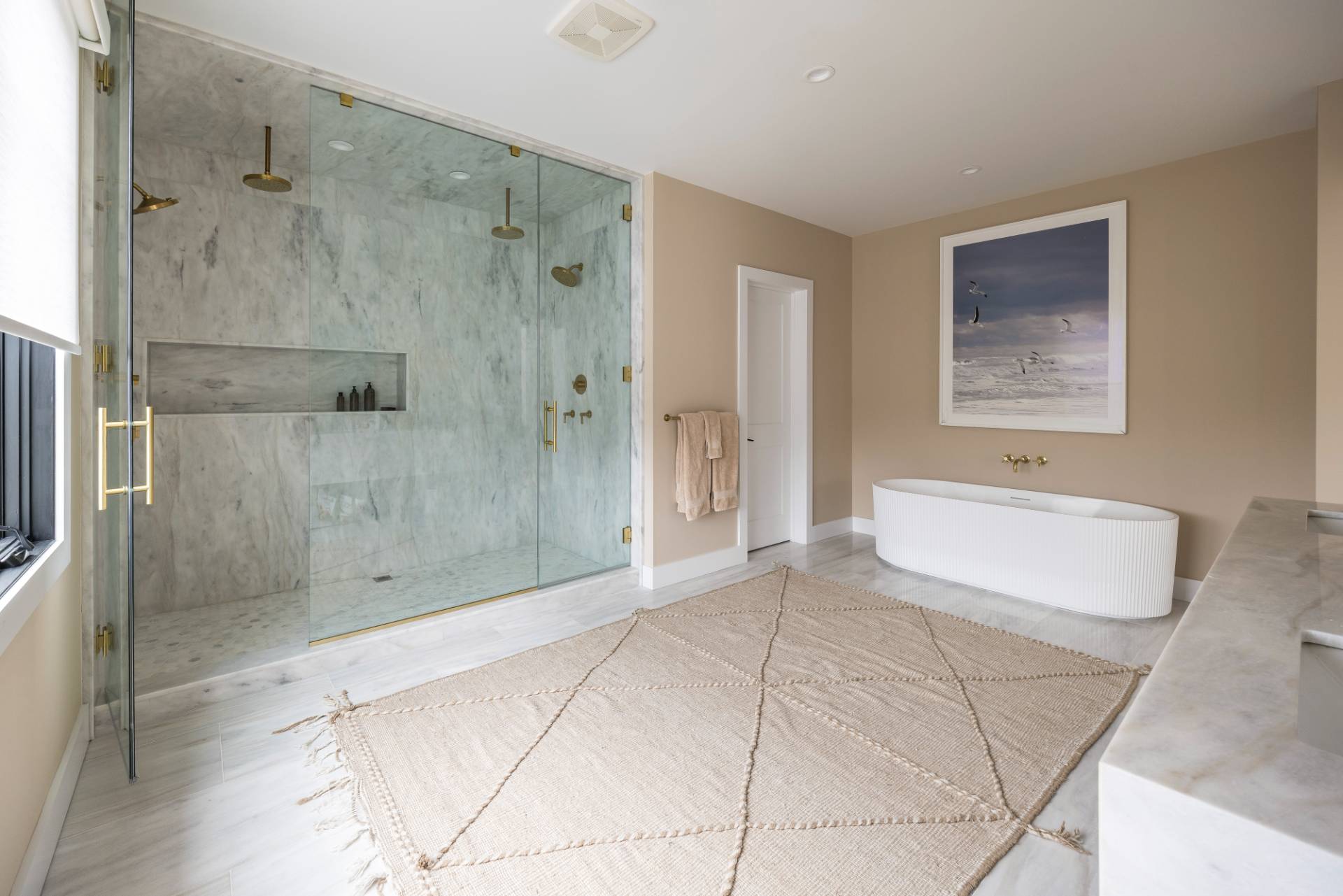 38 Chatfields Ridge Road East Hampton, NY 11937 - Photo 12 of 27 a bathroom with a granite countertop shower a mirror and a sink