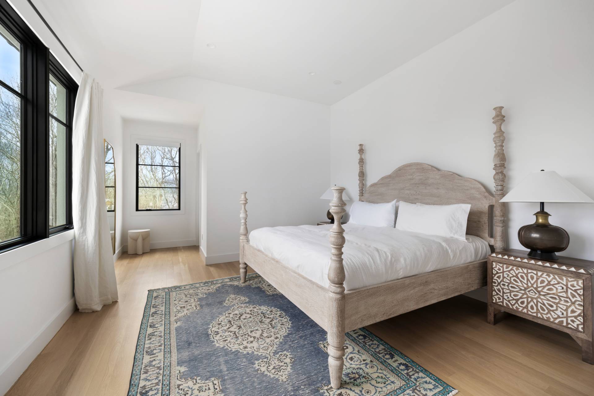 38 Chatfields Ridge Road East Hampton, NY 11937 - Photo 15 of 27 a bedroom with a bed couch and a window