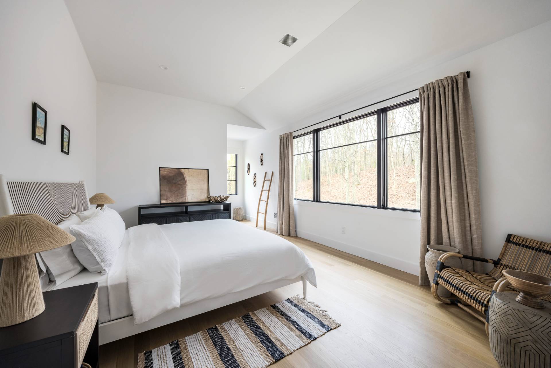 38 Chatfields Ridge Road East Hampton, NY 11937 - Photo 17 of 27 a bedroom with a bed and wooden floor