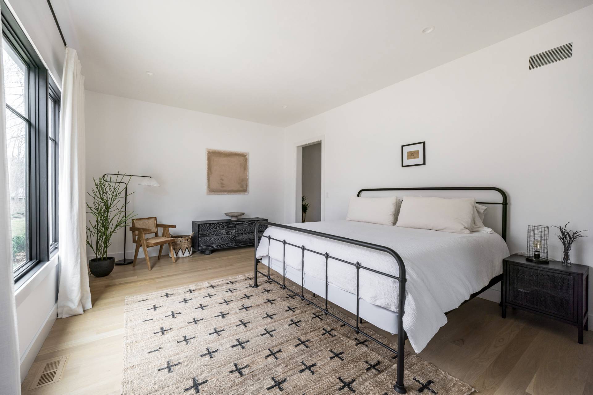 38 Chatfields Ridge Road East Hampton, NY 11937 - Photo 19 of 27 a spacious bedroom with a bed and a couch