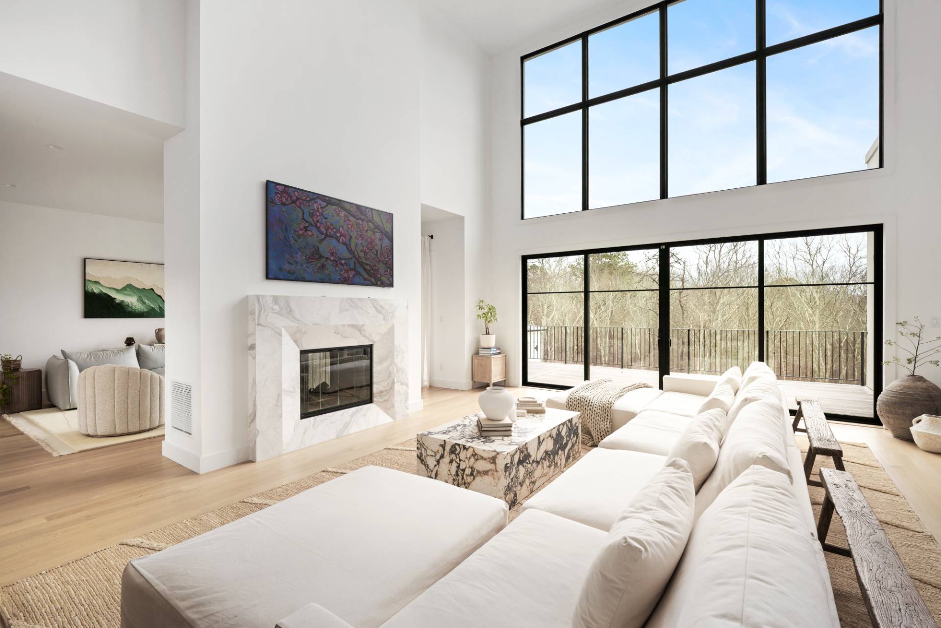 38 Chatfields Ridge Road East Hampton, NY 11937 - Photo 2 of 27 a large bedroom with a large bed and a fireplace