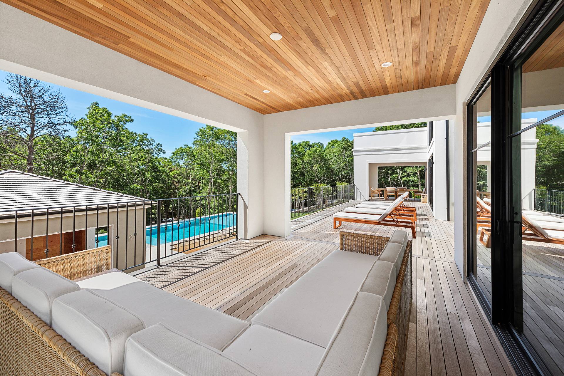 38 Chatfields Ridge Road East Hampton, NY 11937 - Photo 25 of 27 a view of balcony with couch and wooden floor