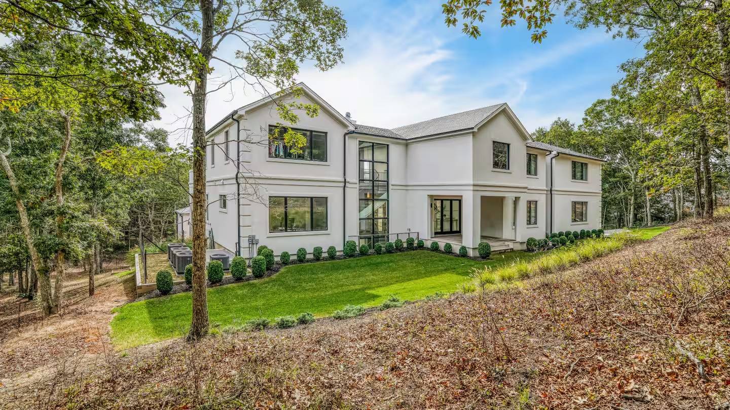 38 Chatfields Ridge Road East Hampton, NY 11937 - Photo 26 of 27 a front view of a house with a yard and porch