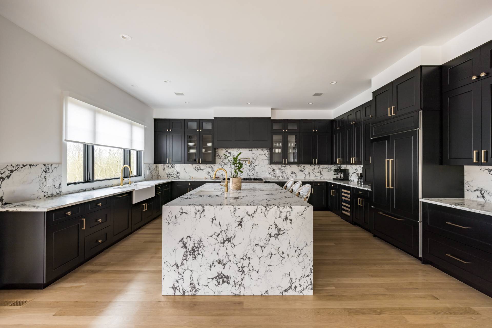 38 Chatfields Ridge Road East Hampton, NY 11937 - Photo 4 of 27 a kitchen with stainless steel appliances kitchen island granite countertop a refrigerator a sink dishwasher a stove and white cabinets with wooden floor