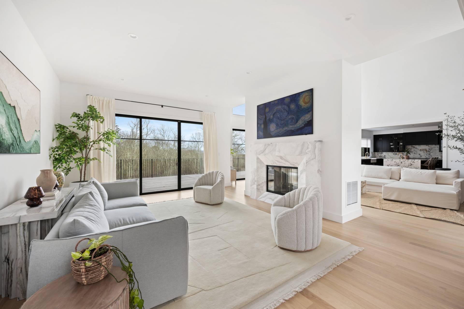 38 Chatfields Ridge Road East Hampton, NY 11937 - Photo 8 of 27 a living room with furniture floor to ceiling window and a fireplace
