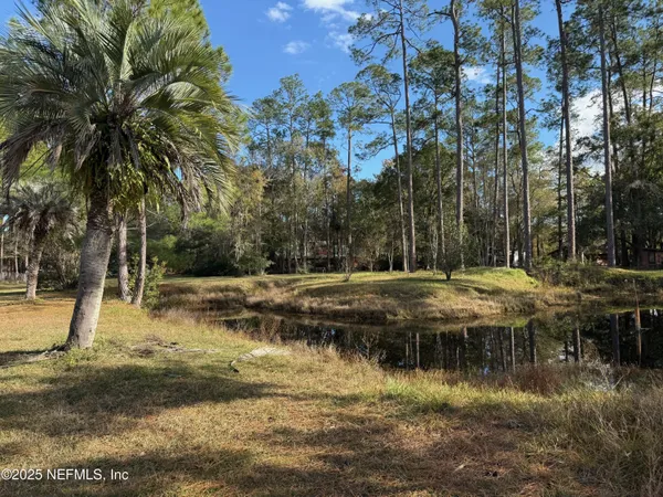a view of swimming pool with a yard