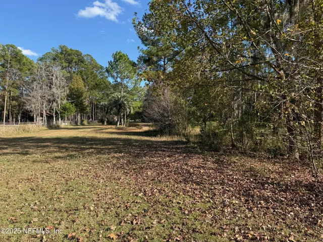 a view of a lake with trees