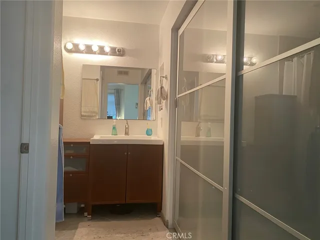a bathroom with a sink and mirror