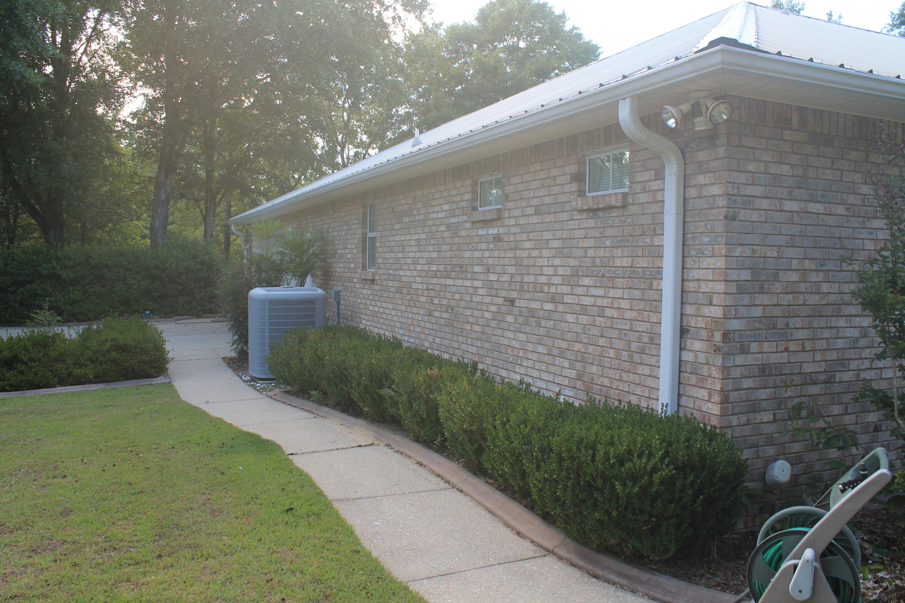 5876 Ward Ranch Road Crestview, FL 32536 - Photo 14 of 50 a brick building with a yard