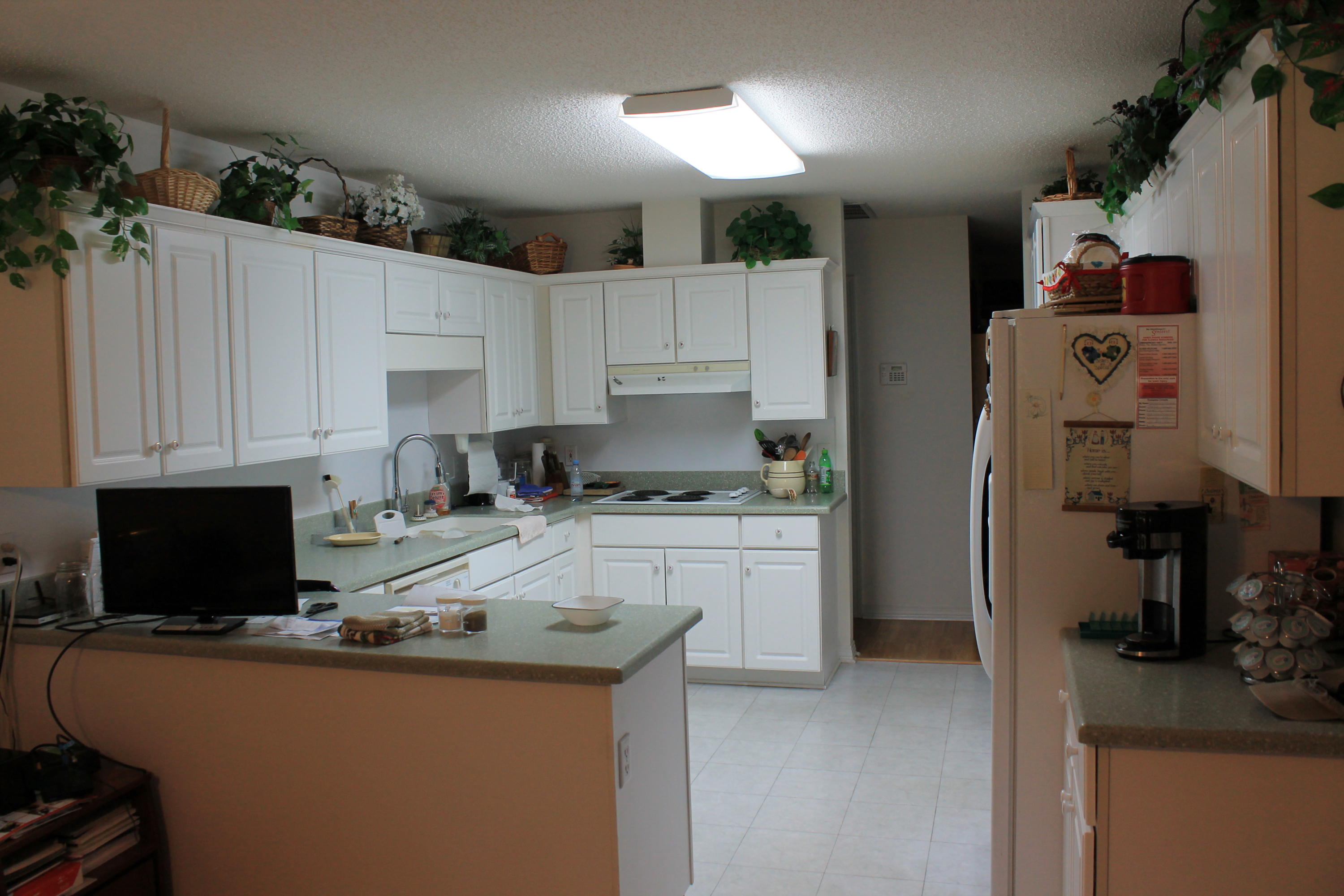 5876 Ward Ranch Road Crestview, FL 32536 - Photo 20 of 50 a kitchen with a sink stove and refrigerator