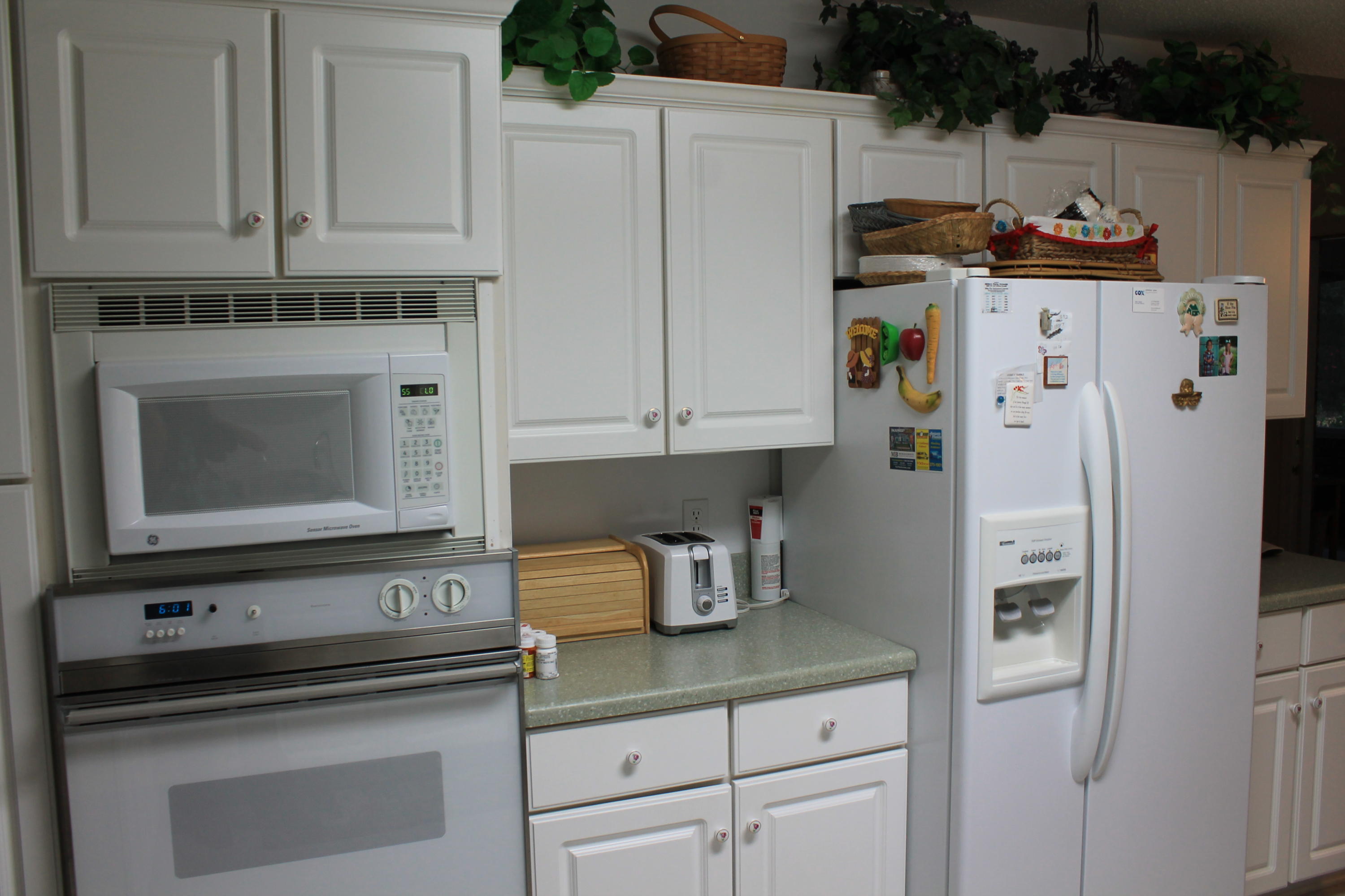 5876 Ward Ranch Road Crestview, FL 32536 - Photo 21 of 50 a kitchen with stainless steel appliances a refrigerator sink and cabinets