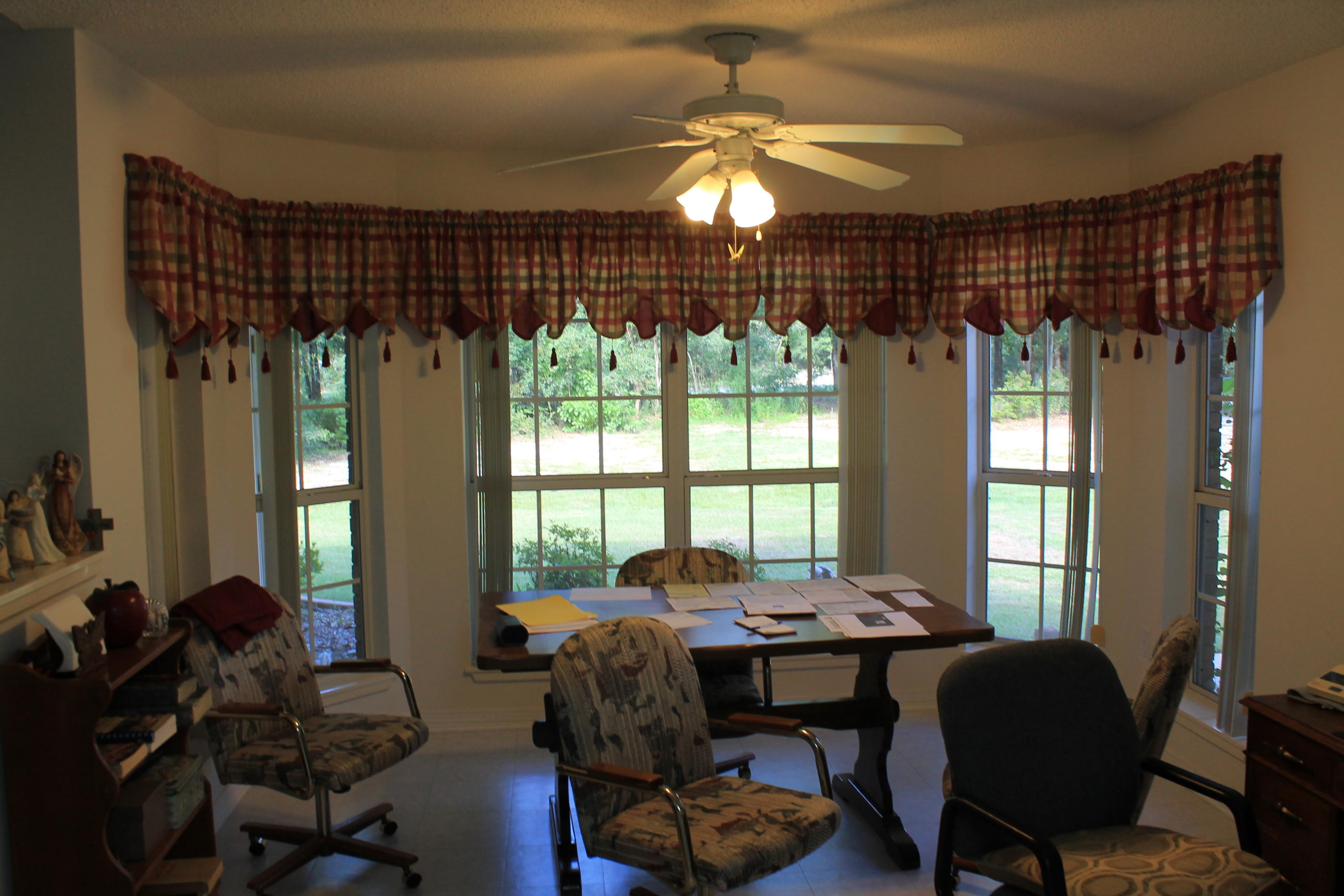 5876 Ward Ranch Road Crestview, FL 32536 - Photo 22 of 50 a living room with furniture and a large window