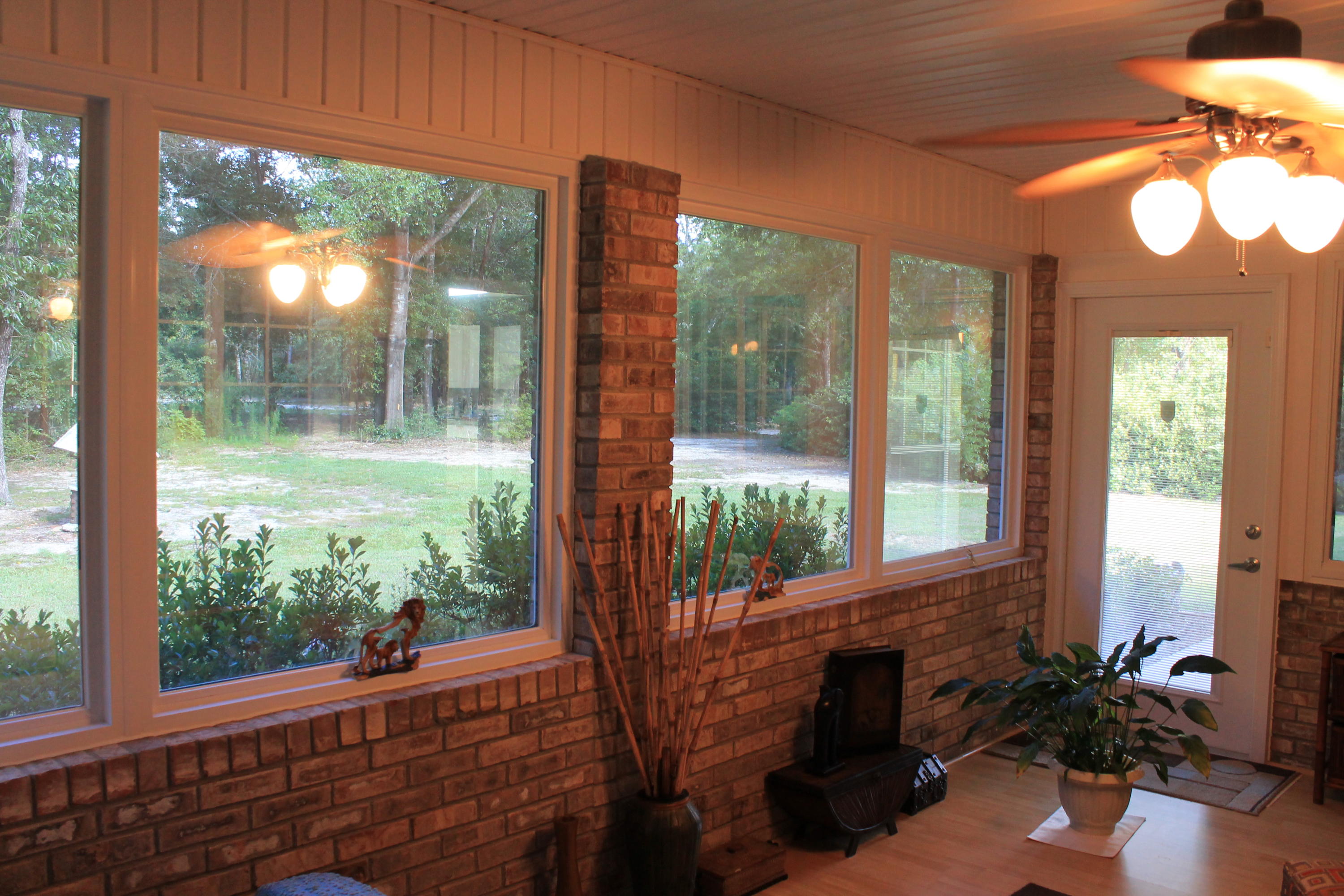 5876 Ward Ranch Road Crestview, FL 32536 - Photo 24 of 50 a room with balcony and wooden floor