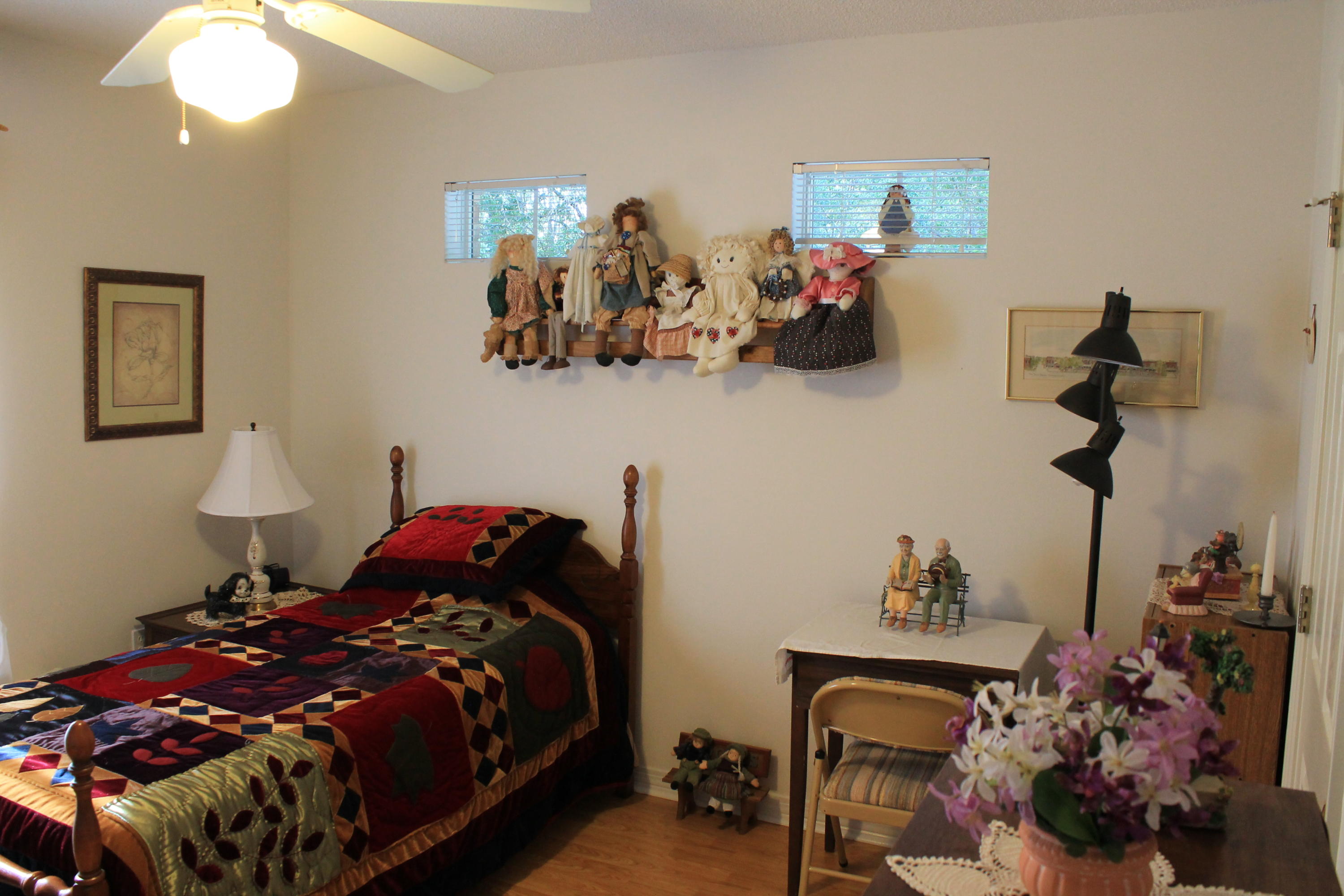 5876 Ward Ranch Road Crestview, FL 32536 - Photo 32 of 50 a bedroom with a bed and a chandelier