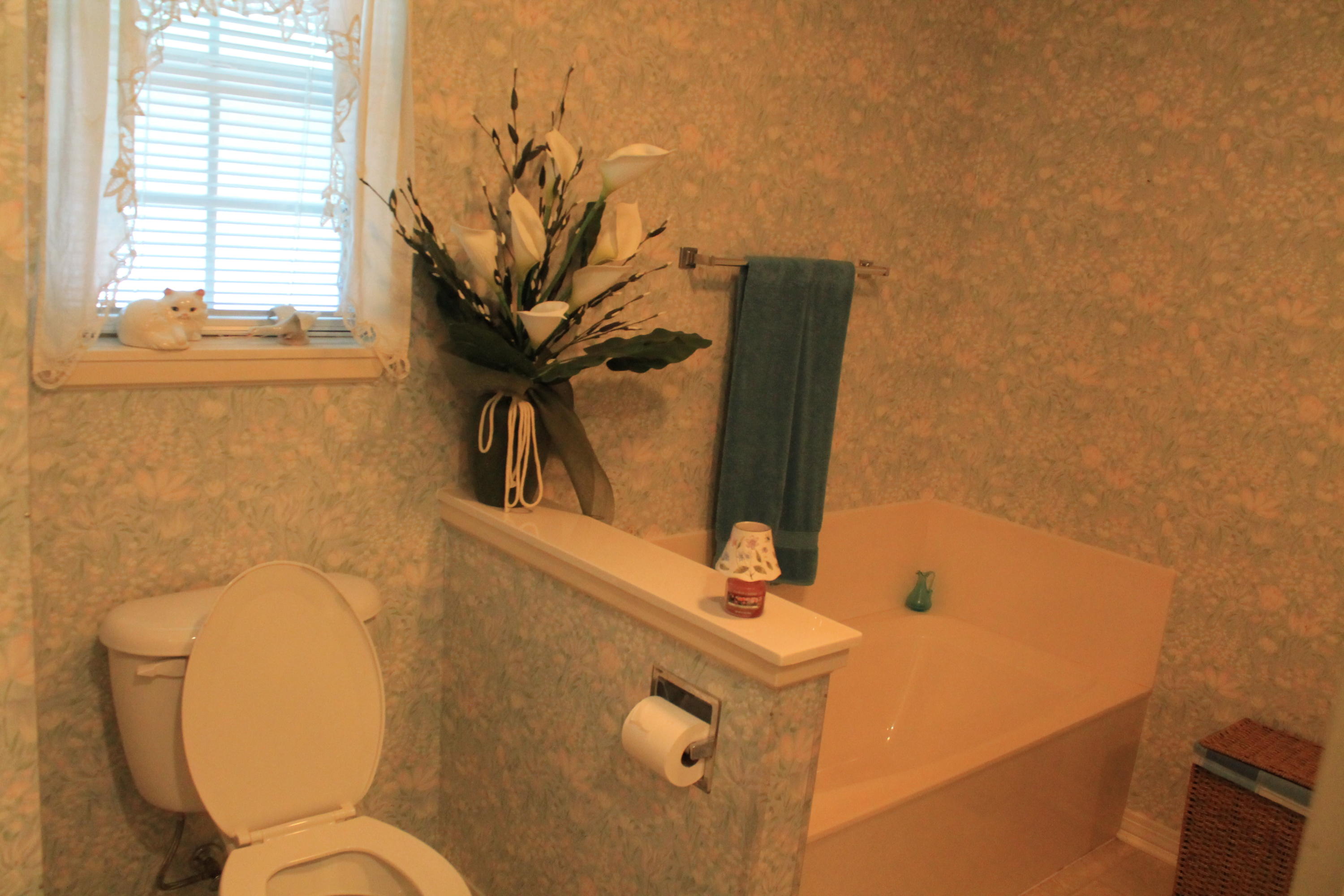 5876 Ward Ranch Road Crestview, FL 32536 - Photo 36 of 50 a bathroom with a toilet sink and mirror