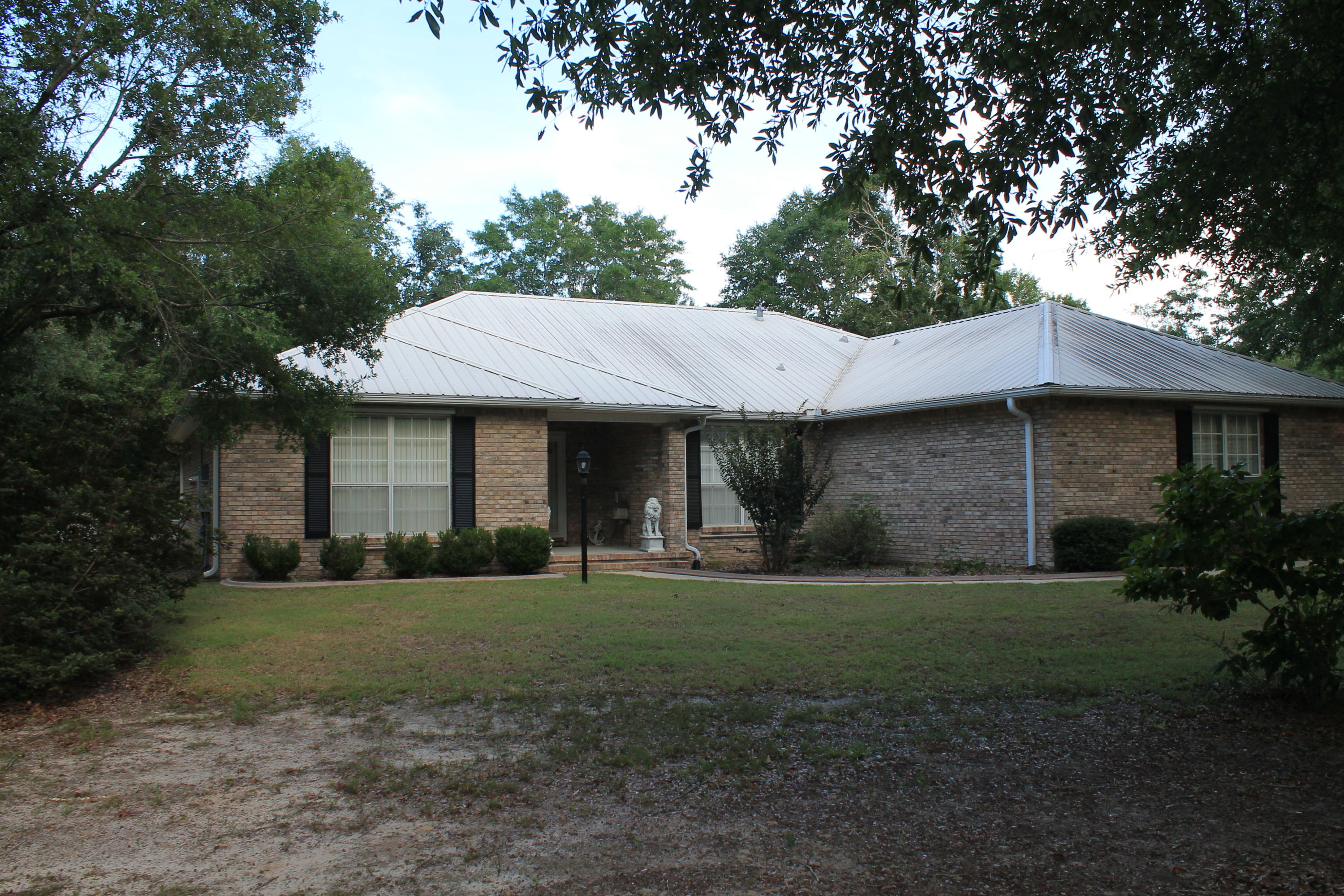 5876 Ward Ranch Road Crestview, FL 32536 - Photo 5 of 50 a view of a house with yard and tree s