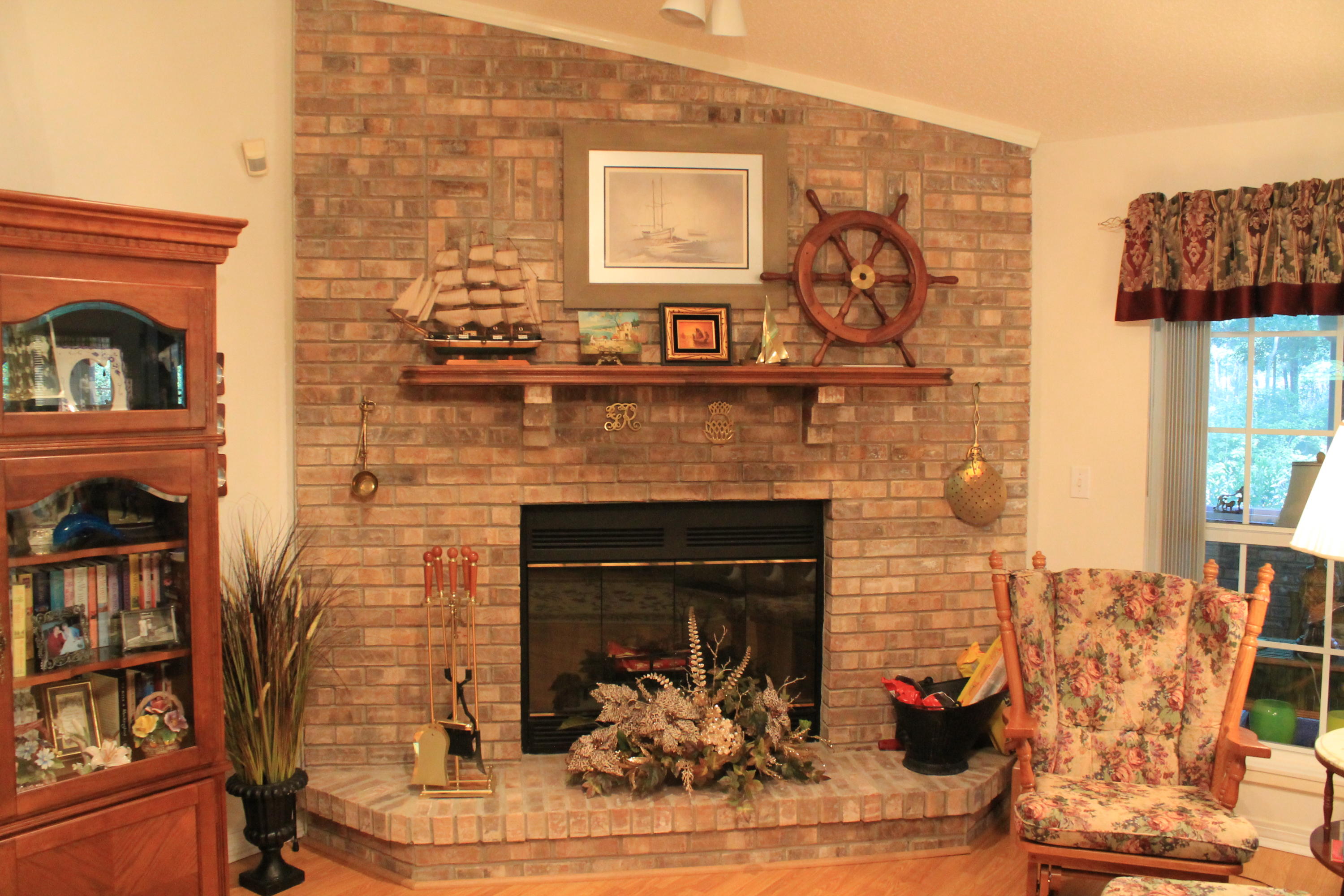 5876 Ward Ranch Road Crestview, FL 32536 - Photo 47 of 50 a living room with furniture and a fireplace