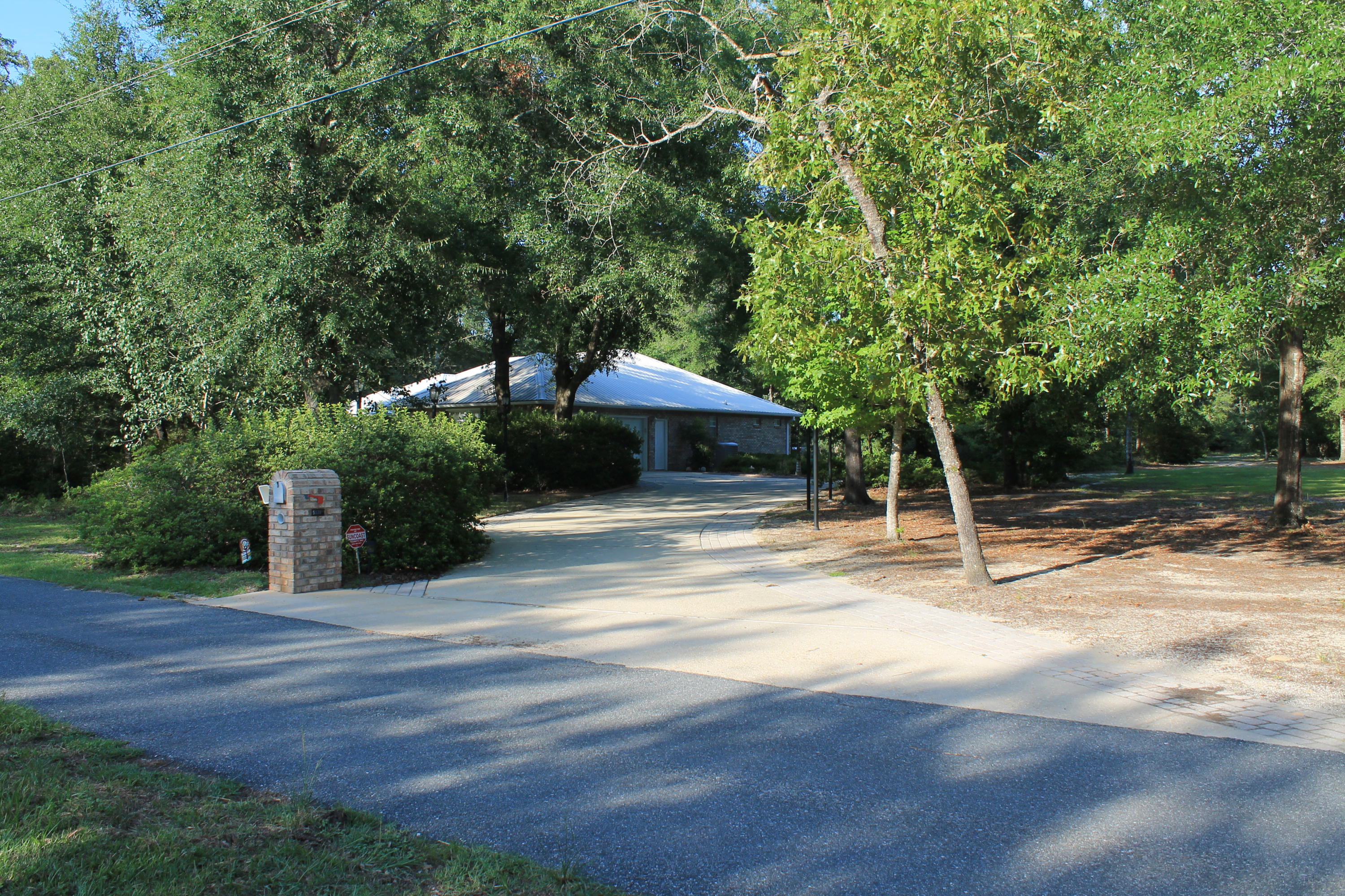 5876 Ward Ranch Road Crestview, FL 32536 - Photo 48 of 50 a view of a house with a yard