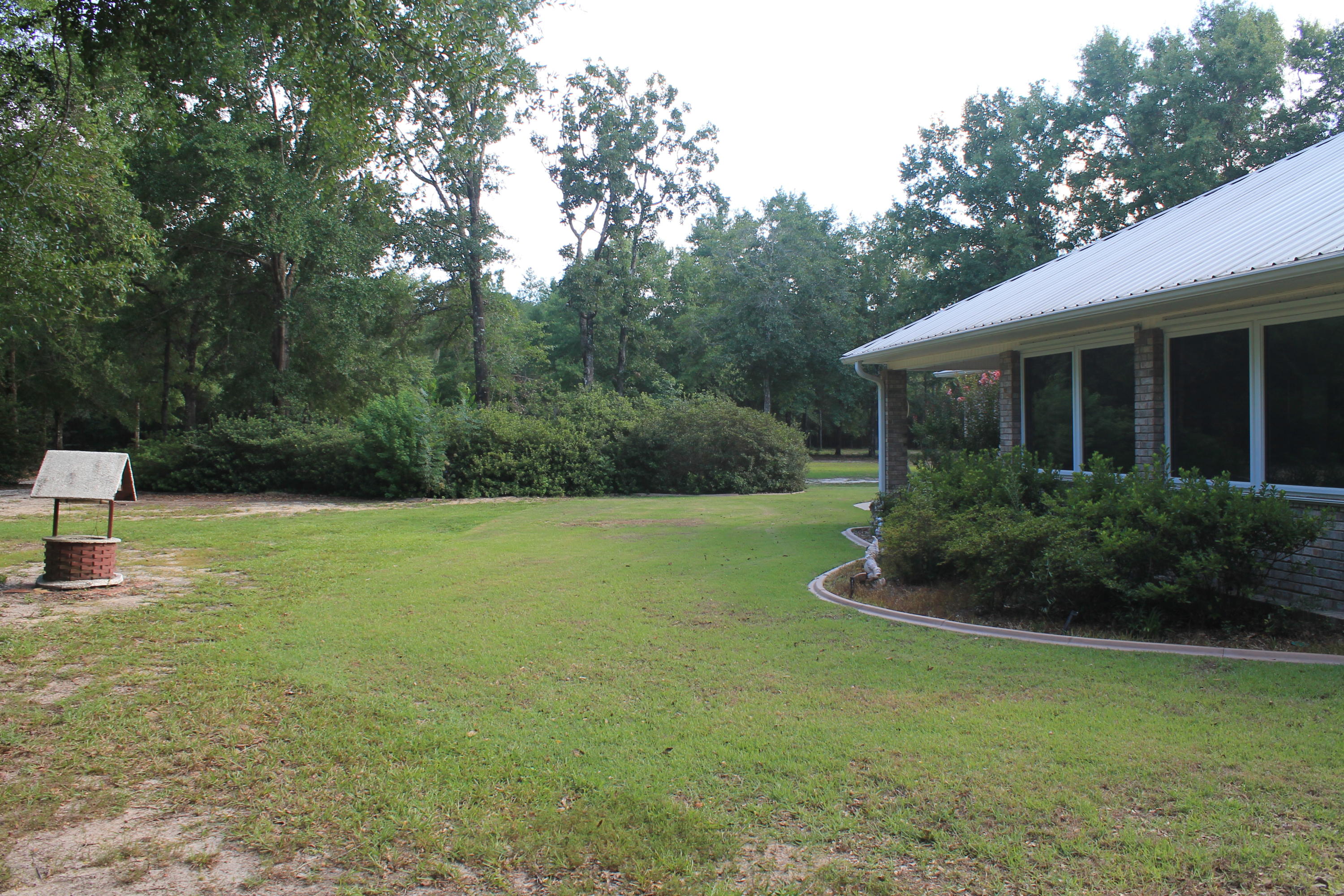 5876 Ward Ranch Road Crestview, FL 32536 - Photo 10 of 50 a front view of a house with garden