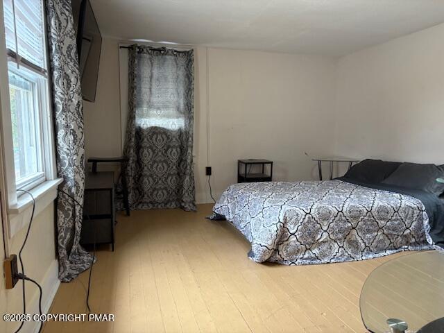 207 Munch Drive Henryville, PA 18332 - Photo 16 of 43 a bedroom with a bed and a window