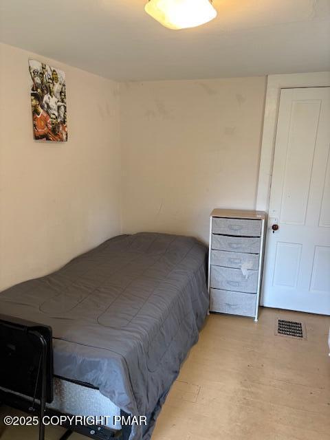 207 Munch Drive Henryville, PA 18332 - Photo 19 of 43 a bedroom with a bed and a cabinets