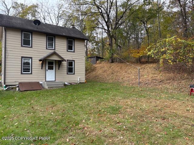 207 Munch Drive Henryville, PA 18332 - Photo 2 of 43 a front view of a house with a yard