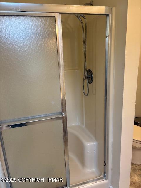 207 Munch Drive Henryville, PA 18332 - Photo 25 of 43 a bathroom with a glass shower door