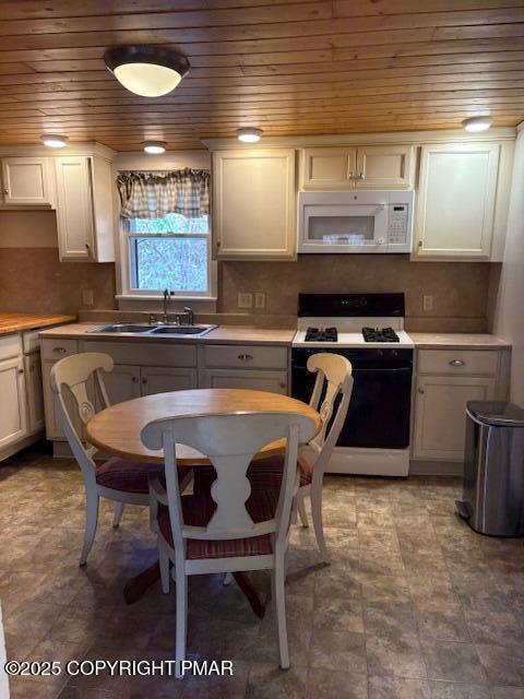 207 Munch Drive Henryville, PA 18332 - Photo 31 of 43 a kitchen with a table chairs sink and cabinets