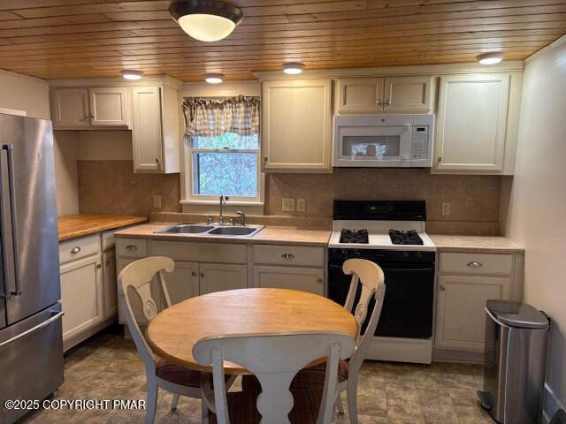 207 Munch Drive Henryville, PA 18332 - Photo 9 of 43 a kitchen with stainless steel appliances granite countertop a sink stove and refrigerator