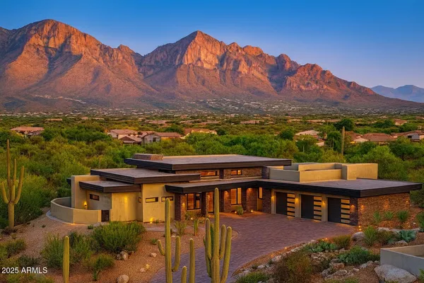 a view of a large pool with a table under an umbrella