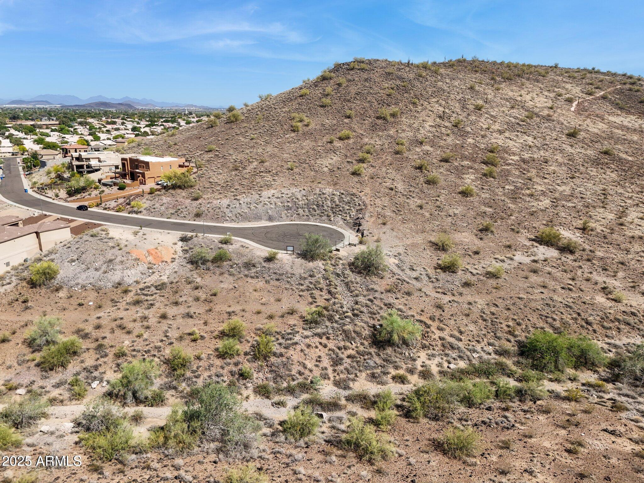 6156 West Alameda Road, Unit 12 Glendale, AZ 85310 - Photo 14 of 19 a view of a field with a mountain in the background