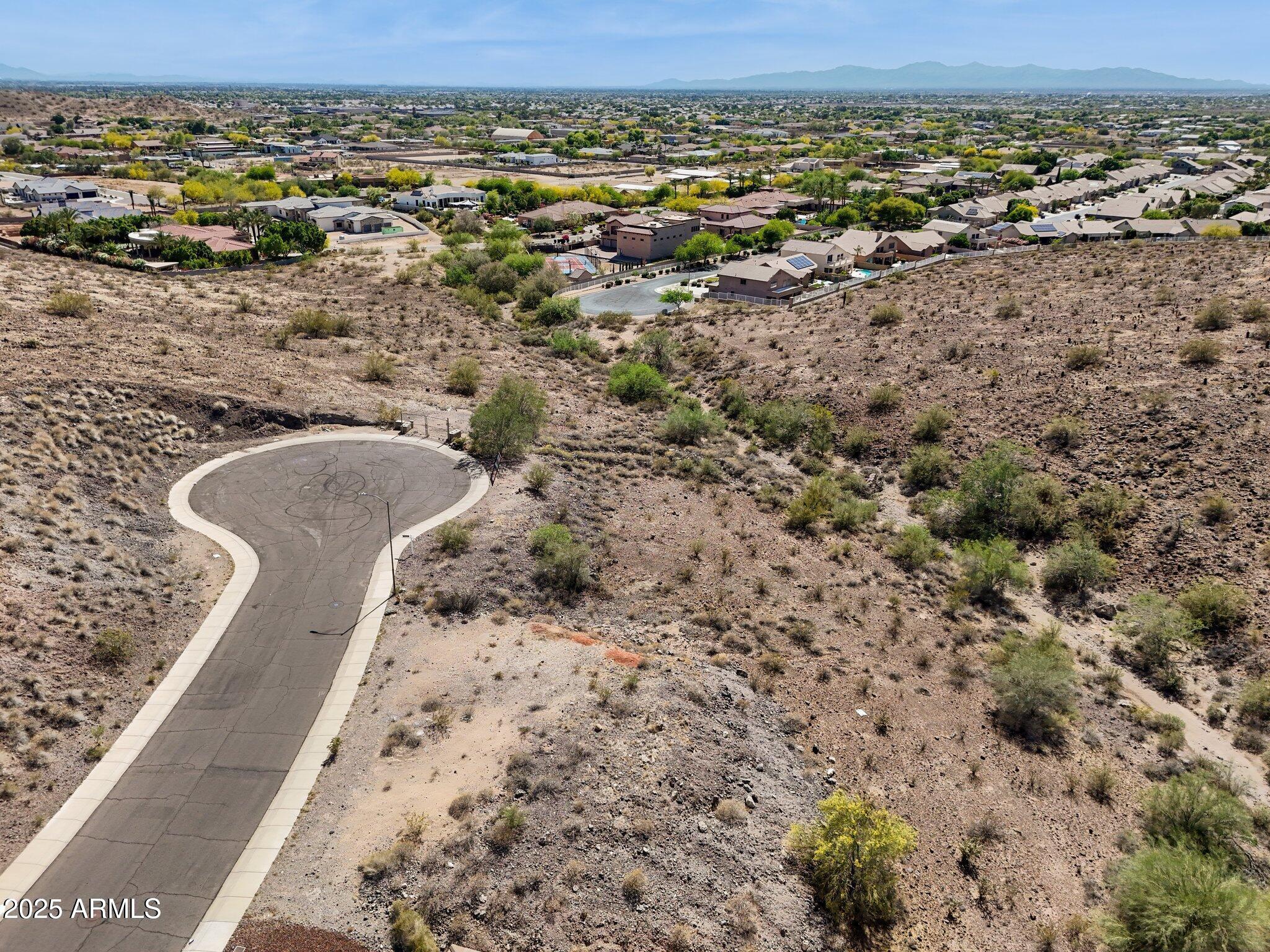 6156 West Alameda Road, Unit 12 Glendale, AZ 85310 - Photo 17 of 19 an aerial view of a house with a yard and lake view