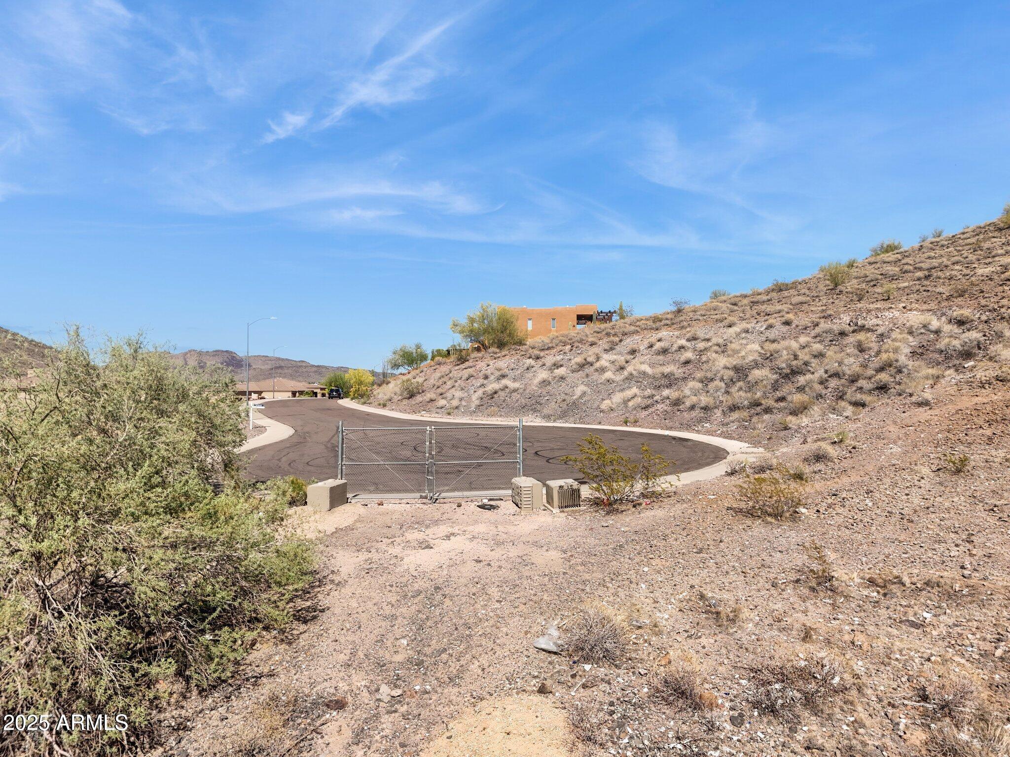 6156 West Alameda Road, Unit 12 Glendale, AZ 85310 - Photo 7 of 19 a view of a dry yard with trees